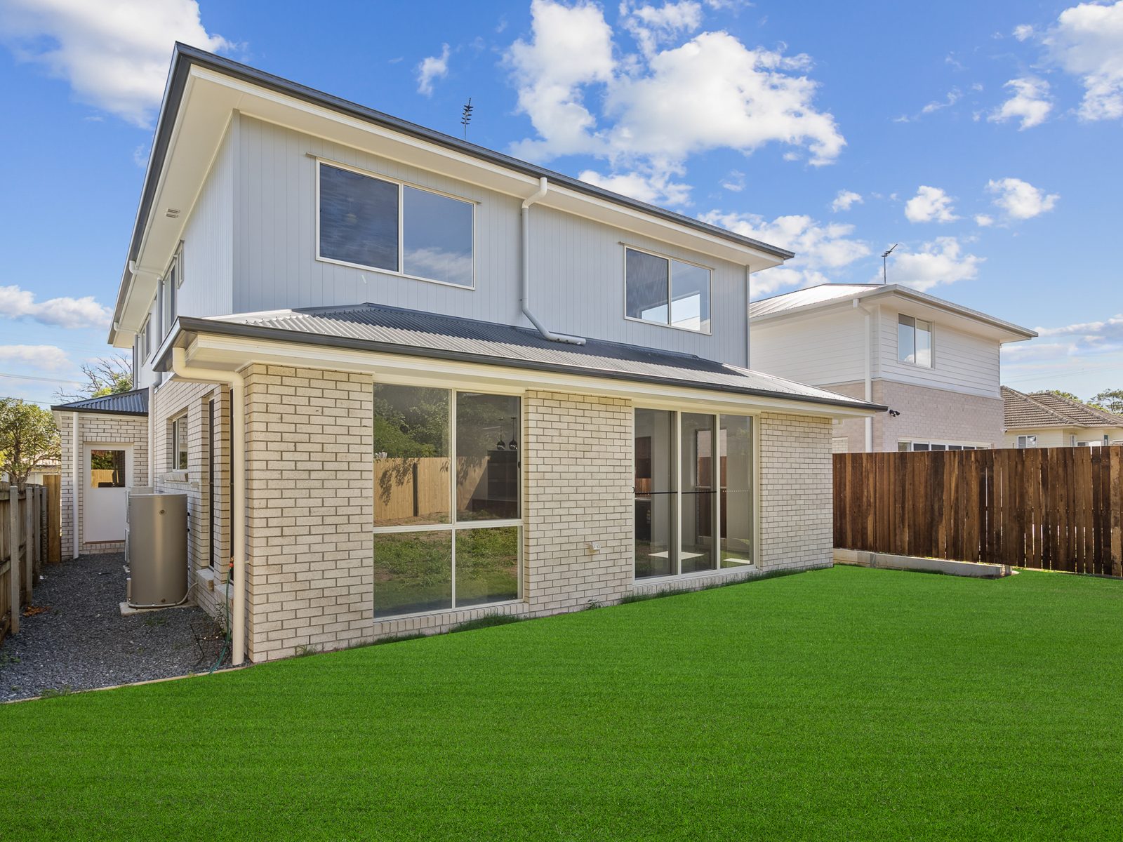 Back of the home with new lawn