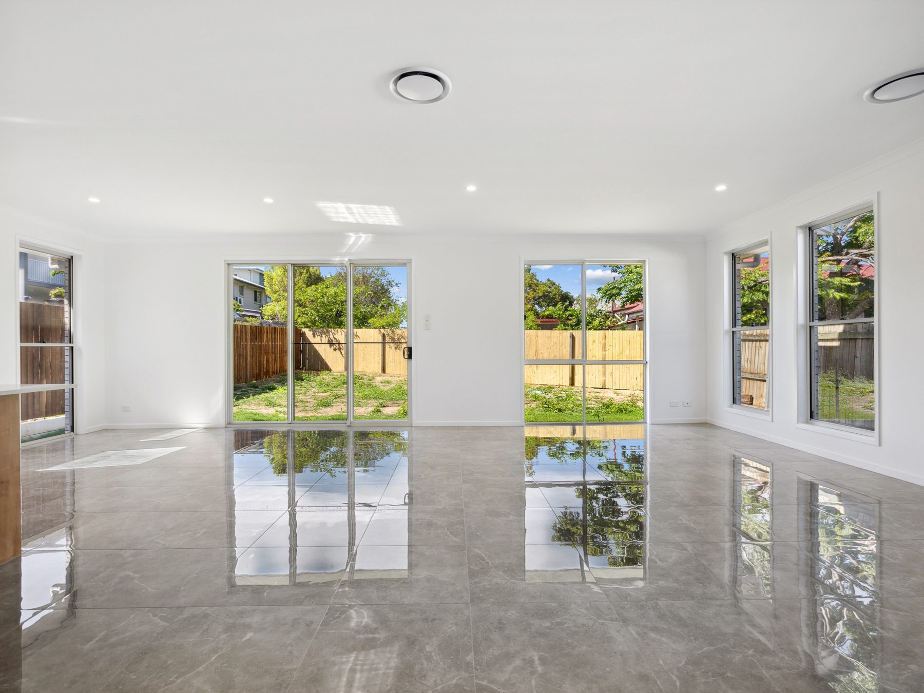 Open-plan living area in an Emerald knockdown rebuild home